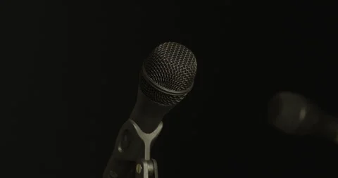 Two mics highlight, then fade into darkness Stock Footage 246965222