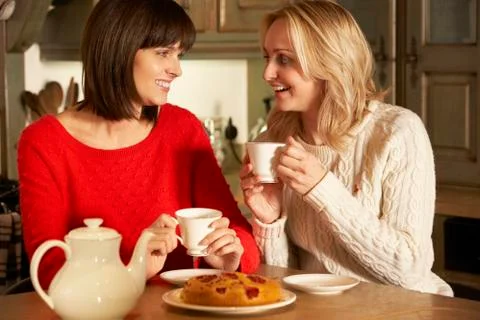 Two Middle Aged Women Enjoying Tea And Cake Together Stock Photos