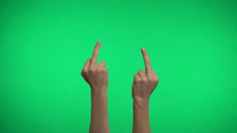 Two middle fingers on a green background. Video stock 163599792
