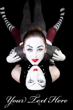 Two mimes on black background 스톡 사진