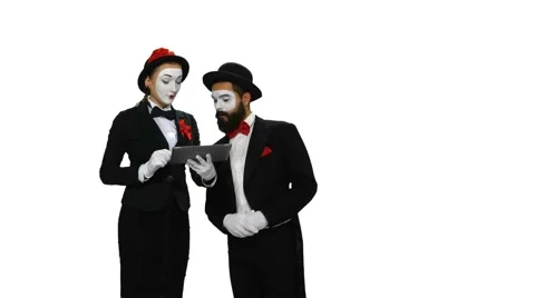 Two mimes dicusses something using tablet computer on white screen Stock-Footage 47708140