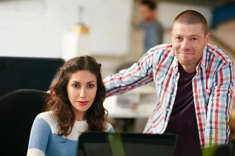Two minds to create a winning design. two coworkers using a computer together in 스톡 사진