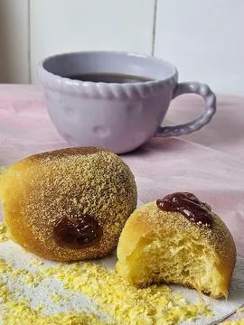Two mini cornbreads with coffee in the background. Stock Photos