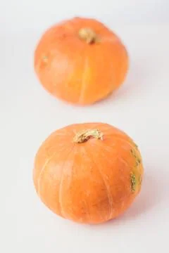 Two mini pumpkins on white background. Stock Photos