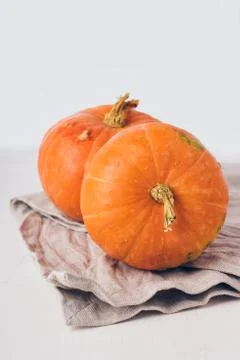 Two mini pumpkins on white background. Stock Photos