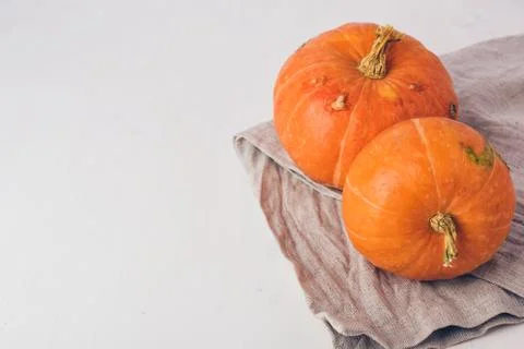 Two mini pumpkins on white background. Stock Photos
