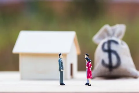 Two Miniature bargain front small residence on wooden table. Stock Photos