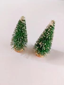 Two miniature Christmas trees Stock Photos