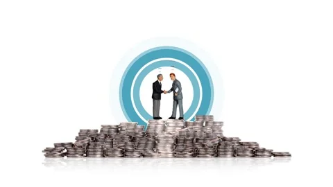 Two miniature men shaking hands on a pile of coins. Stock-Footage 273839073