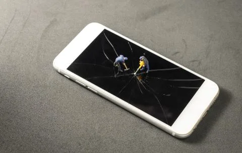 Two miniature worker drilling to the broken damage screen of mobile phone Stock Photos