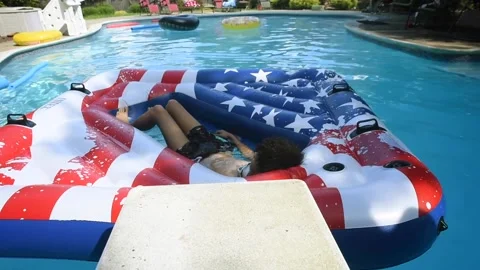 Two mixed boys have a fun in the swimming pool Video stock 136491878