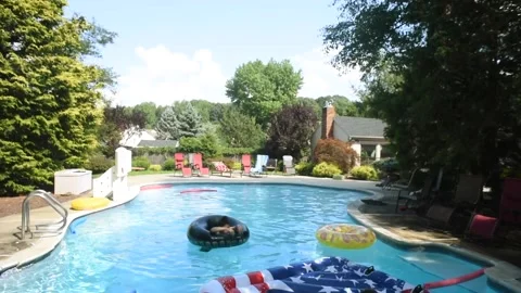 Two mixed boys have a fun in the swimming pool Video stock 136492038