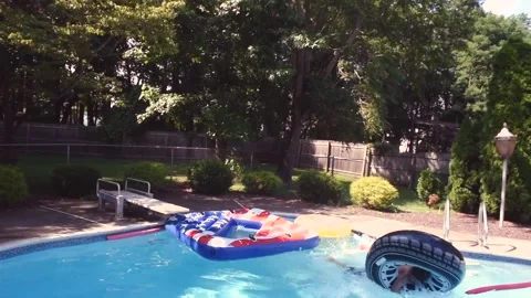 Two mixed boys have a fun in the swimming pool Video stock 136492101