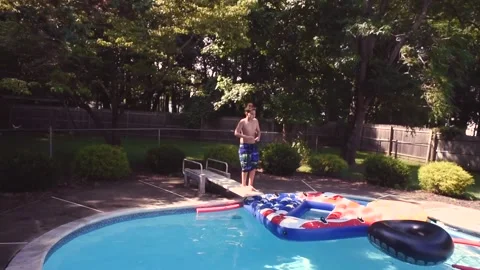 Two mixed boys have a fun in the swimming pool Video stock 136492119