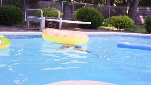 Two mixed boys have a fun in the swimming pool Video stock 136492216