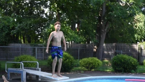 Two mixed boys have a fun in the swimming pool Video stock 136492393