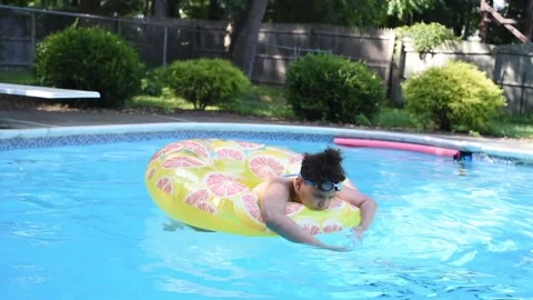 Two mixed boys have a fun in the swimming pool Video stock 136492787