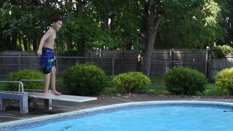 Two mixed boys have a fun in the swimming pool Stock Footage 136493056