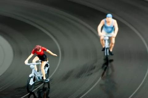 Two model people in cycle race Stock Photos