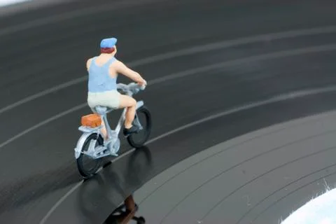 Two model people in cycle race Photos