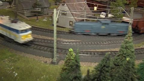 Two model trains passing eachother Stock Footage 88429868