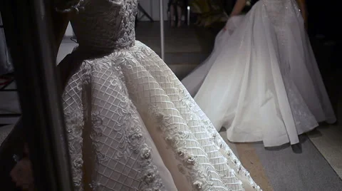 Two models in beautiful wedding dresses pose for the photographers and prepared Video stock 69071459