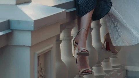 Two models of the girl sit on the gothic railing. Urban fashion. Stock Footage 104237557