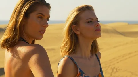 Two models looking in the distance Stock Footage 106191328