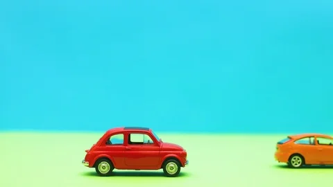 Two modern car passing fast by vintage red car - Stop motion Stock-Footage 125498974