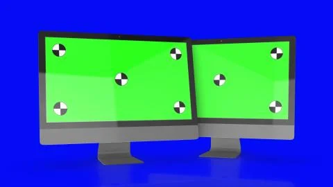 Two Modern computers with green screen, isolated on blue background . 3d render. Illustrazione stock