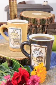 Two modern cups of tea or coffee on table Stock Photos