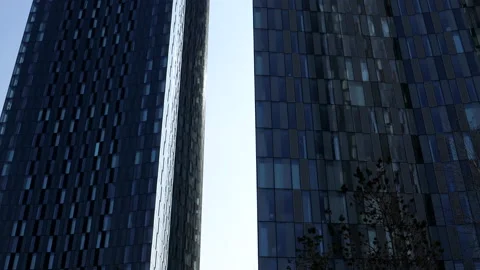 Two modern tall buildings tilt up shot | Stock Video | Pond5