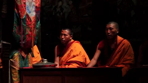 Two monks chanting prayers during a prayer session in monastery, Mustang, Nepal Stock Footage 62923804