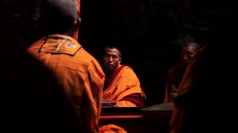 Two monks preaching a group of monks during a prayer session, Mustang, Nepal Stock Footage 62923802