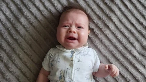 A Two-Month-Old Baby Is Lying Down And Crying Stock Footage 273973041