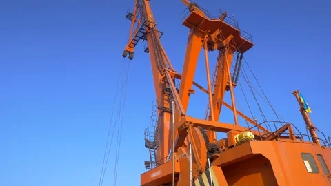 Two moored floating cranes stand in the port in anticipation of a tugboat. 4K. Stock Footage 84326987