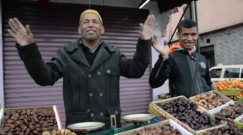 Two Moroccan men selling dates in Marrakech, Morocco Stock Footage 49594672