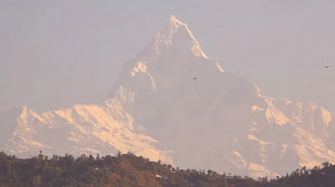 Two motor hang gliders flies against Machapuchare peak. Stock Footage 25437463
