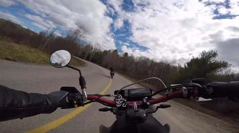 Two motorbikes going through a corner, rider POV Stock Footage 49742250