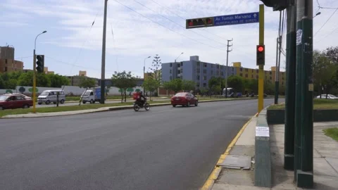 Two motorcycles not respecting the red light of a traffic light Stock Footage 150288747