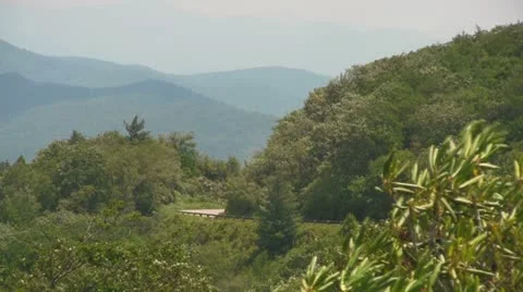 Two Motorcycles Riding in the Distance on the Blue Ridge Parkway Video stock 12742355