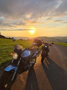 Two motorcycles sunset Stock Photos