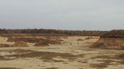 Two motorcyclists ride on a sandy off-road and jump over a small hill. Stock Footage 142094597