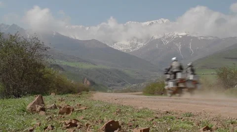 Two motorcyclists riding in the mountains Stock Footage 50054707