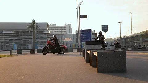 Two motorcyclists walk slowly down the alley Stock-Footage 114566839