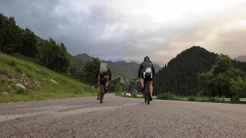 Two mountain bikers riding on bikes bikepacking style Video stock 157528405