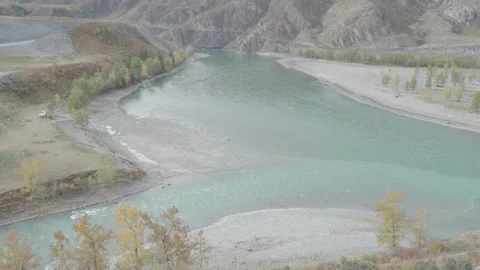 Two mountain rivers with blue water confluence. View from top Stock Footage 85590478