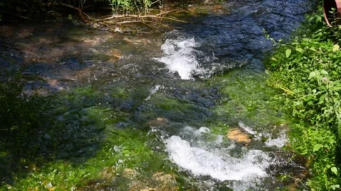 Two mountain streams intersect Stock Footage 95774298