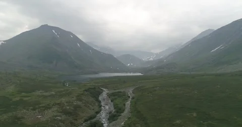 Two mountains, river and green valley. Ural. Aerial view. Stock Footage 269540335