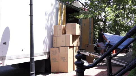 Two movers loading a van Stock Footage